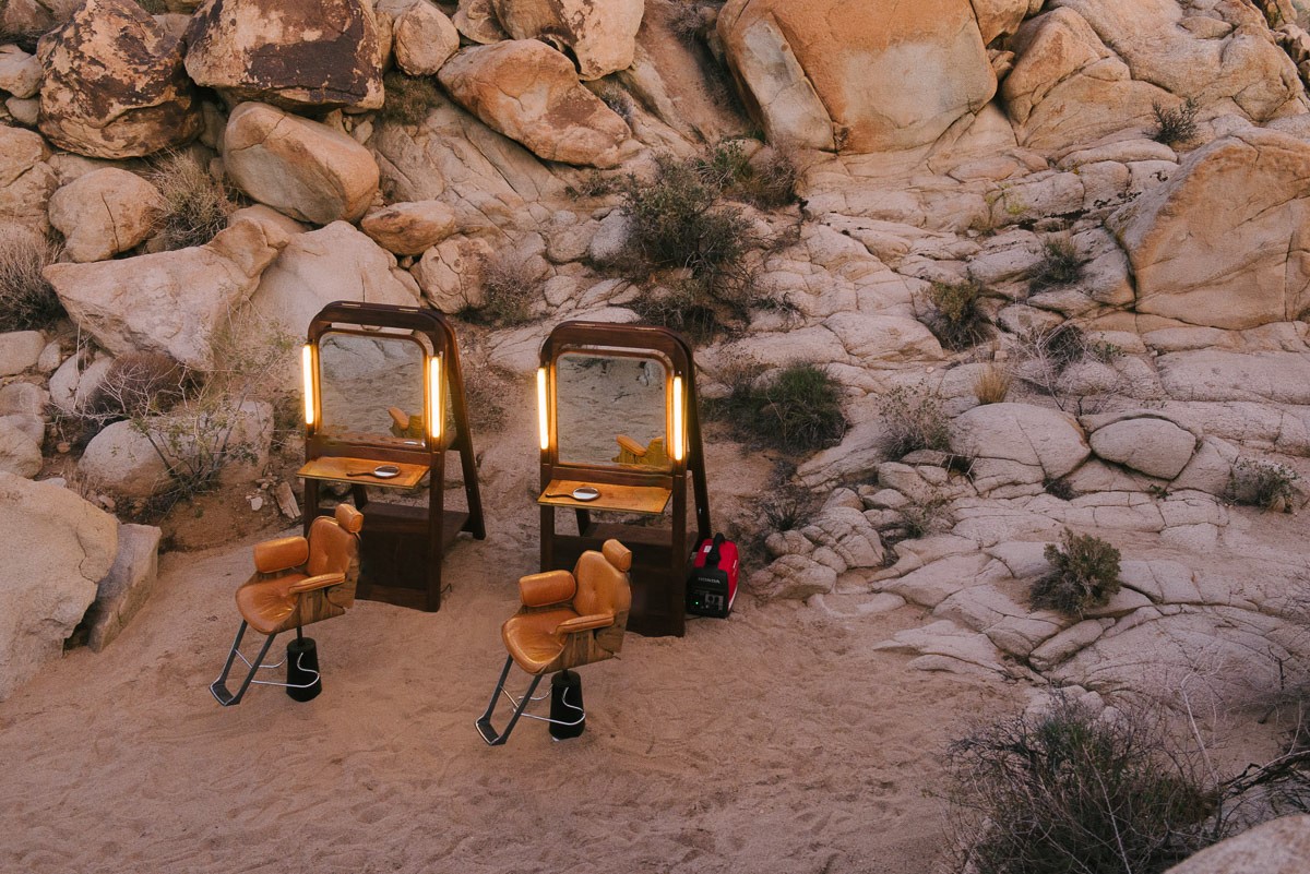 Two Fellow Barber chairs set up in the desert at Joshua Tree